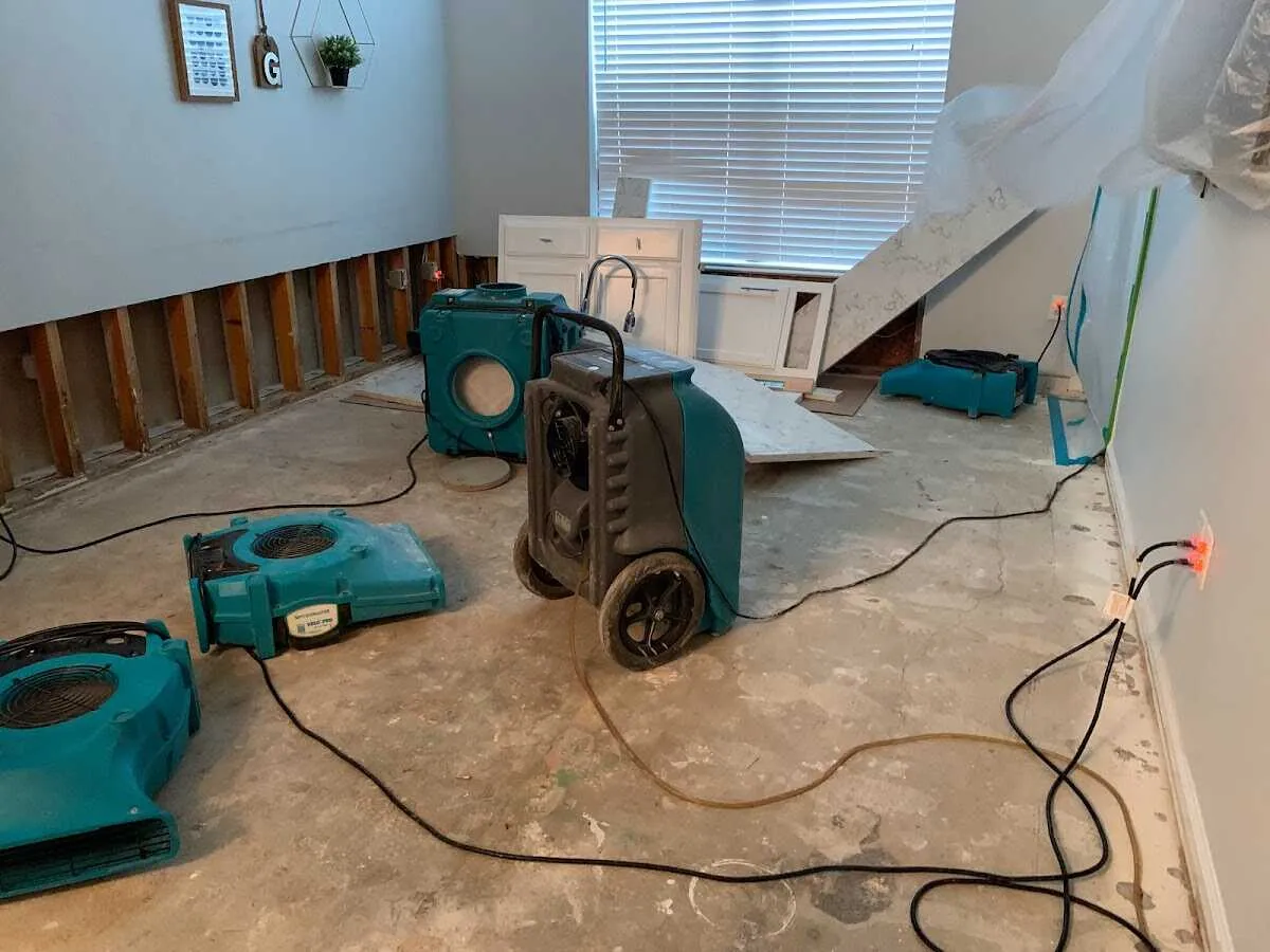 Dehumidifier in flood-cut room for Water Damage Restoration in Fox Point